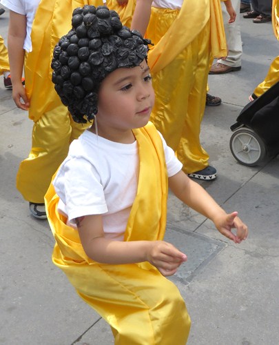 Little Buddhas at end of parade, still with proper hand positions.  Copyright ©2015 Ruth Lor Malloy