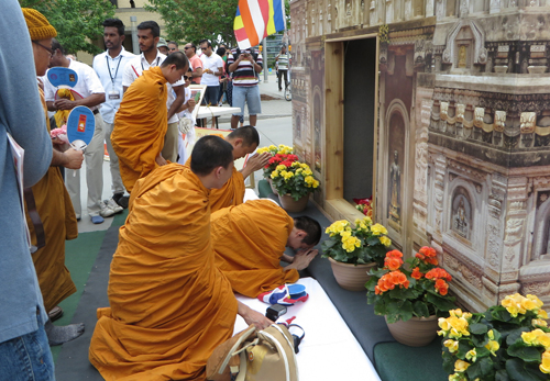 Paying homage at replica of Bodhgaya temple.  Copyright ©2015 Ruth Lor Malloy