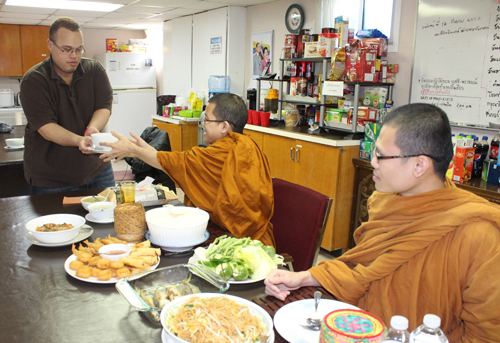 Davis Riley Helps Serve Monks. Copyright ©2014 Ruth Lor Malloy. 